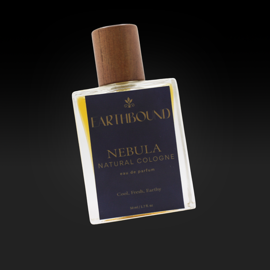 Nebula Eau de Parfum natural cologne bottle by Earthbound Scents with gold label on black background