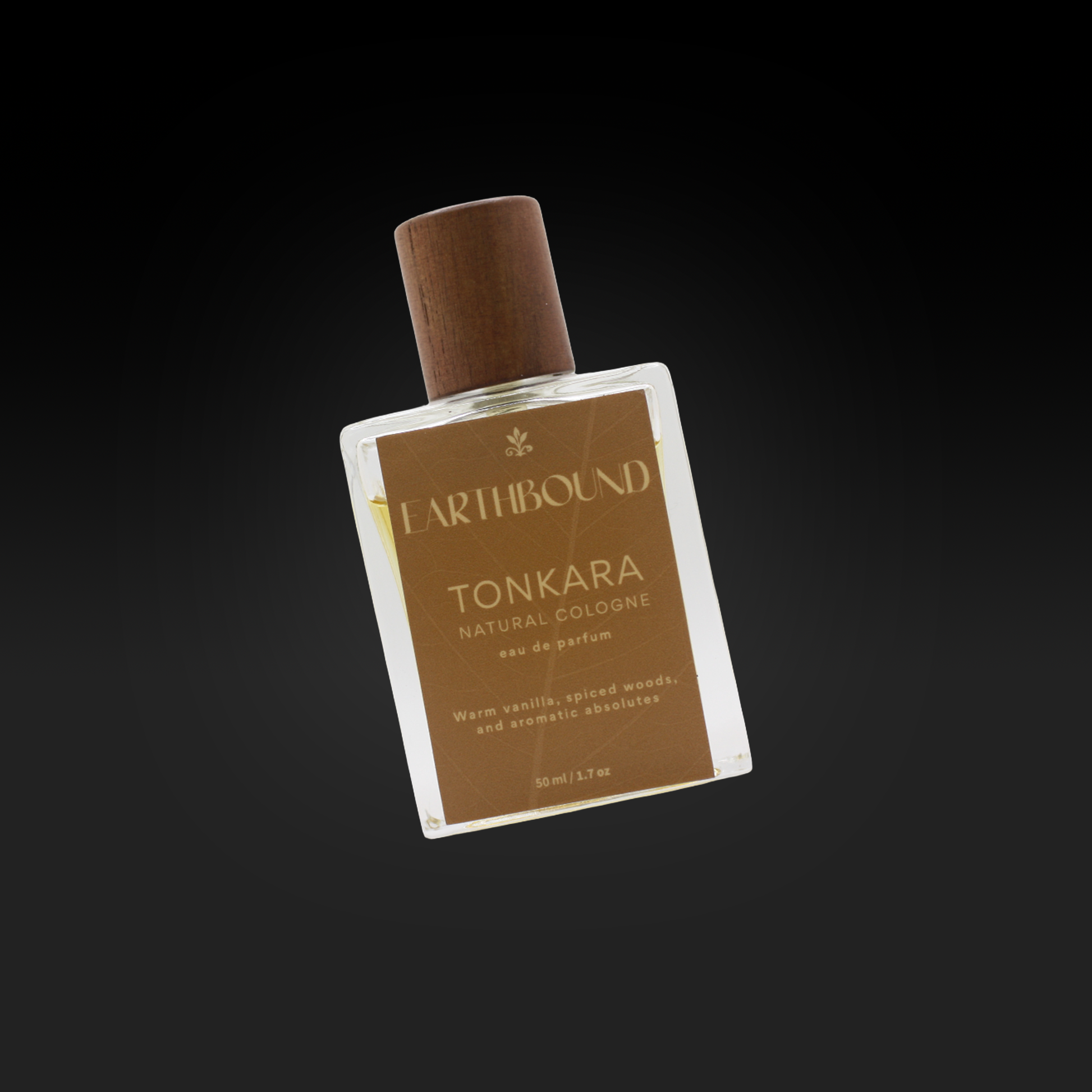 Tonkaura Eau de Parfum bottle natural cologne by Earthbound Scents on black background